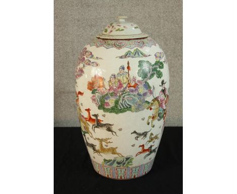 A Chinese famille Rose porcelain vase and cover decorated with Chinese gods and deer in the clouds, bearing six character sea