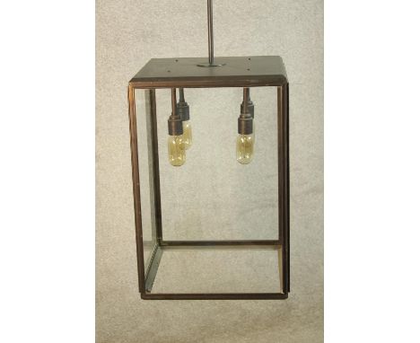 A contemporary brushed brass and glass rectangular hanging lantern. H.43 cm. 