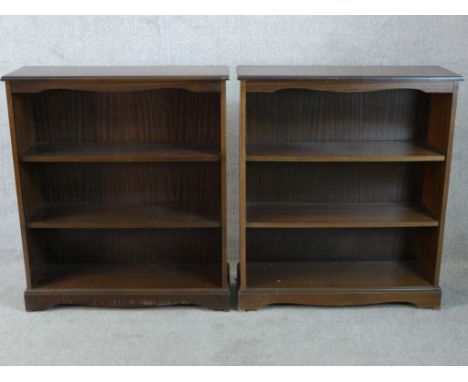 A pair of stained three shelf open bookshelves raised on shaped bracket feet. H.98 W.85 D.30cm 