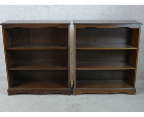 A pair of stained three shelf open bookshelves raised on shaped bracket feet. H.98 W.85 D.30cm 