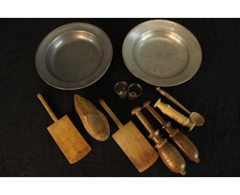 A pair of 19th century pewter dishes, together with a small quantity of turned wooden tools. H.4 Dia.23cm. (largest) 