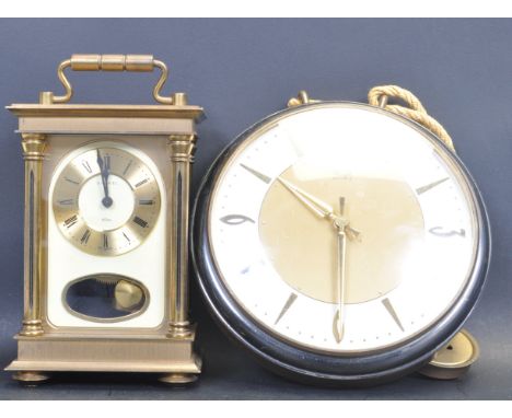 A late 20th century 8 day carriage clock by H Samuel having a brass and glass case with carry handle to the top. Together wit