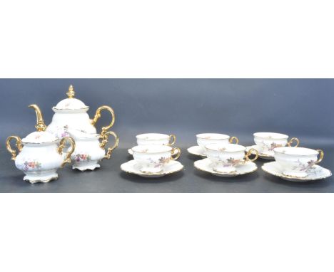 A vintage mid 20th century ceramic tea service by Bavaria having gilt edging with polychrome foliate decoration and gilt hand