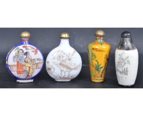 A group of four 20th century Chinese oriental snuff / opium bottles. Three enamel bottles decorated with floral motifs and pe