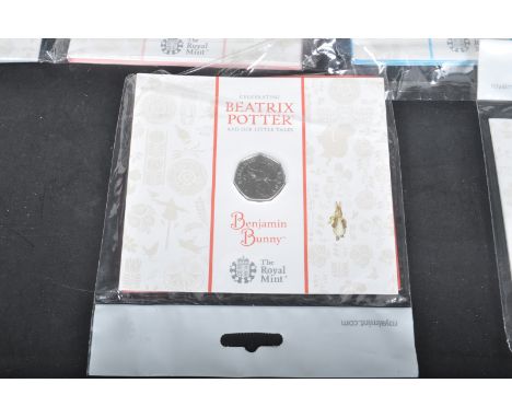 A collection of brilliant uncirculated coins comprising of a Royal Mint Mr Jeremy Fisher 50p, Beatrix Potter Benjamin Bunny, 