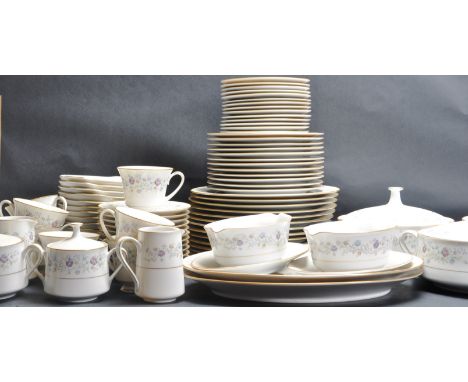A contemporary fine china Noritake Longwood dinner service and tea service comprising of tea cups, saucers, side plates, crea