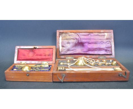 Two 19th century Victorian Hydrometers set within mahogany cases. The hydrometer comprises of a float, weights and thermomete