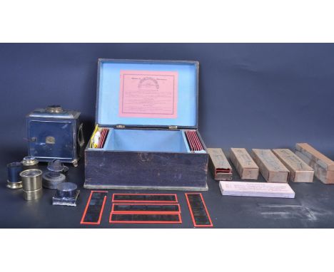 An early 20th century circa 1910’s German Magic Lantern and slides. The Fabrik Marke German made lantern in original wooden b