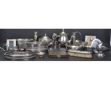 A large collection of 20th century silver plated table ware to include teapot, candlesticks, sugar bowl, trays, teaspoons, pi