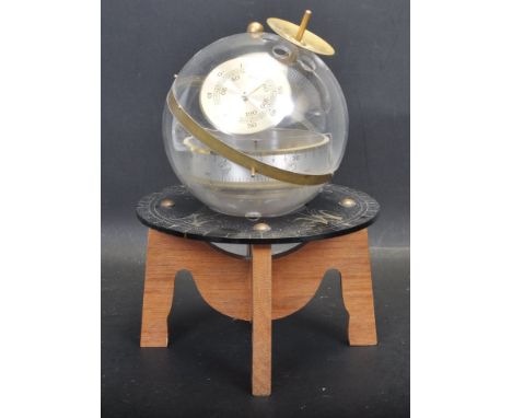 A vintage 20th century Huger Sputnik ES weather station, West German, incorporating a barometer, hygrometer and a thermometer