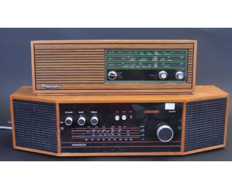 A pair of vintage retro mid 20th century teak wood case radio receivers. A rectangular teak wood case Murphy radio with front