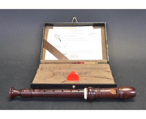 A Moeck Rottenburg Palisander / rosewood mode 419. The two pieces Moeck recorder designed by Friedrich Von Huene No. 1690, co