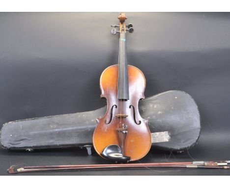 An early 20th century Tatra by Rosetti 'Stradivarius model'. Violin complete with case and bow. The paper label also with not