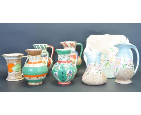 A collection of early 20th century circa 1930s Art Deco Myott China comprising of a two jugs with a polychrome floral design 