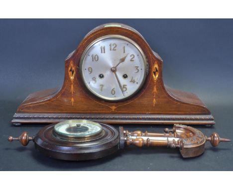 A circa 1910 early 20th century mahogany cased Napoleons hat mantel clock having inlaid decoration, silvered clock face with 
