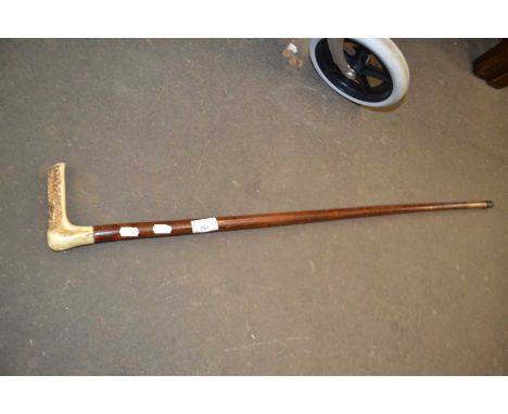 An antler handle walking stick