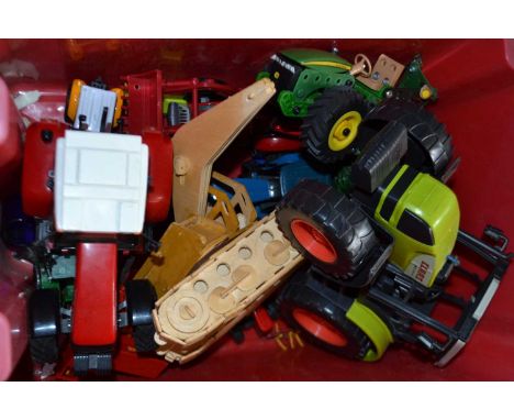 Quantity of assorted children's toys to include a Claus tractor, John Deere tractor and others similar