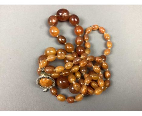 LOT OF COSTUME JEWELLERY,including a Chinese hardstone amulet, amber-type beads and further costume jewellery
