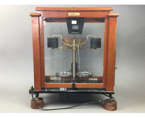 SET OF CHEMIST'S PAN SCALES,the glazed case 50cm high