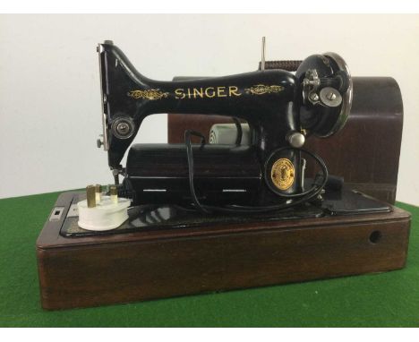 VINTAGE SEWING MACHINE,cased, along a folding card table (2)