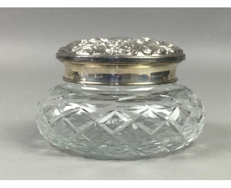 THREE SILVER TOPPED SCENT BOTTES/VANITY JARS,the tallest 12.5cm high, together with a boxed Egyptian white metal four-piece c