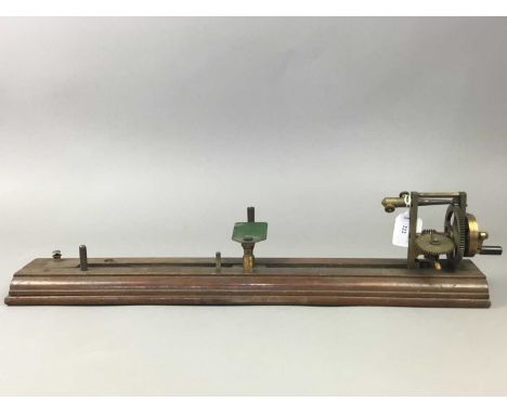 19TH CENTURY BRASS YARN TESTER,by J.H.Heal of Halifax, in a wood case, 66cm longThe item is very dirty and would benefit from