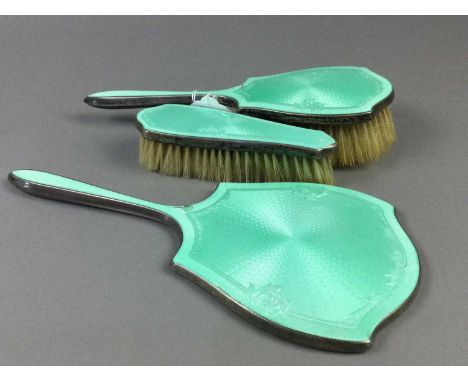 EARLY 20TH CENTURY SILVER AND GREEN GUILLOCHE ENAMEL VANITY SET,comprising a handmirror and two brushes