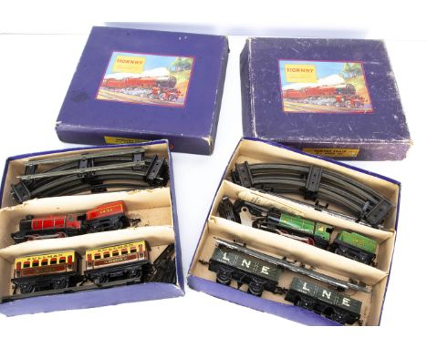 Two boxed Hornby 0 Gauge M1 clockwork Train Sets, comprising 'NE Goods Set' with green loco and tender 3435, two dark grey LN