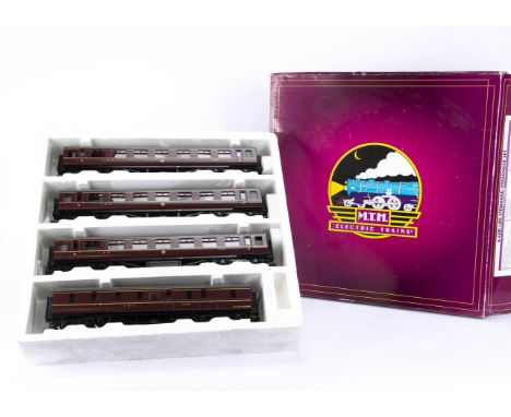 A rake of four LMS Standard 0 Gauge Coaches by MTH, all in LMS crimson, as 3rd class coaches 8958/59/60, and 57' full brake 3