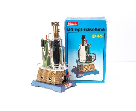 A boxed Wilesco D45 live steam Vertical Engine, with chromed vertical boiler on copper-finished brickwork firebox, with water