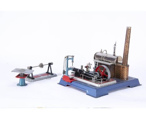 A Wilesco live steam tablet-fired Stationary Engine and Accessories, on blue base with red trim, copper-finished firebox and 