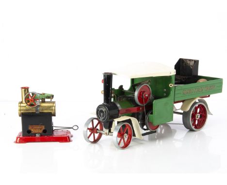 A Mamod spirit-fired SW1 Steam Wagon and MM1 Engine, the SW1 in green with red trim and (repainted) off-white roof and mudgua