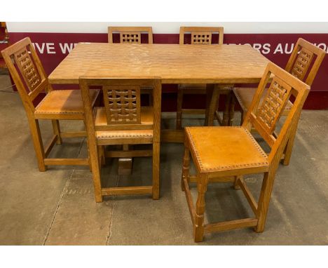 A Mouseman style Yorkshire School oak refectory table and six chairs, manner of Robert Thompson