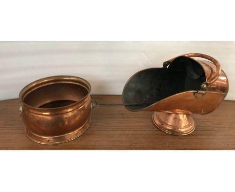 A copper coal scuttle and a planter 