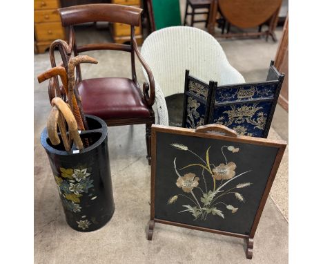 A George IV mahogany elbow chair, a wicker chair, two fire screens and a stick stand with canes