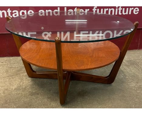 A Lebus teak and glass topped circular coffee table 