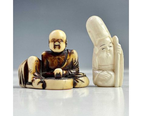 A Japanese stained ivory netsuke, Meiji period, height 3.5cm and another ivory netsuke, Meiji period, height 4.5cm. (2)