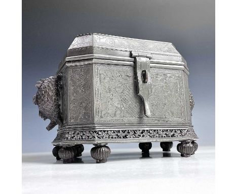 An Anglo-Indian pewter tea caddy, 19th century, with twin compartments, the handles in the form of fish and with floral decor