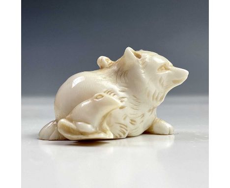 A Japanese ivory netsuke of a bear and cub, Meiji period, signed, height 2.5cm, width 4cm.