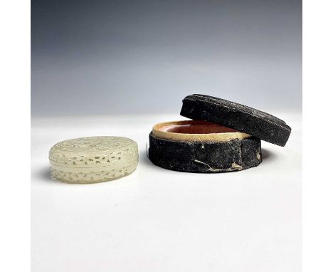 A Chinese pierced jade circular box and cover, late Qing/Republic period, worked in details with a sage/scholar and young boy
