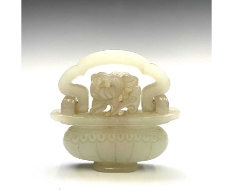 A Chinese jade-type pendant in the form of a basket of flowers, mid 20th century, with swing handle, 5.7 x 6cm.Condition repo