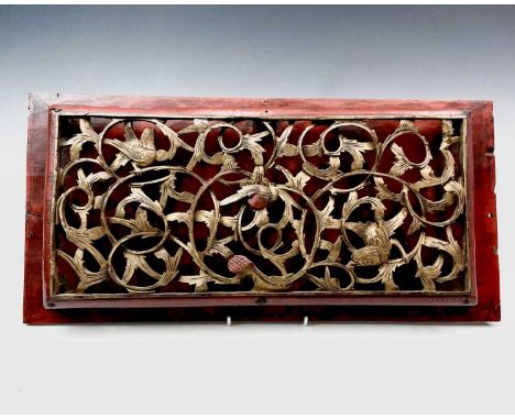 A Chinese carved giltwood rectangular panel, circa 1900, with birds and scrolling foliage, height 24cm, width 50cm, depth 4cm