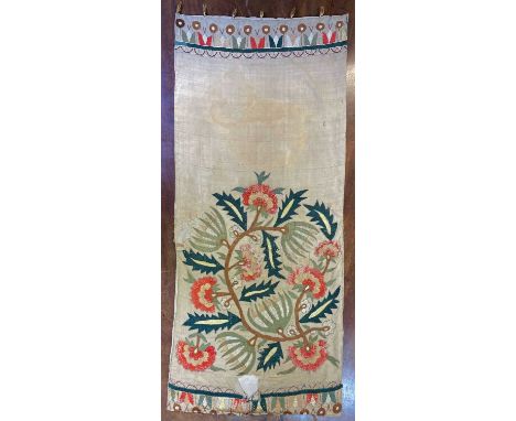 An Uzbekistan tapestry panel, 19th century, decorated in polychrome silk with flowering branches, 104 x 46cm.