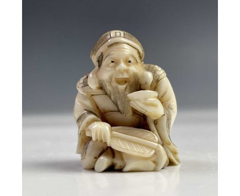 A Japanese ivory netsuke, Meiji period, signed, height 3cm, width 2.2cm. 