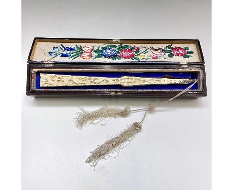 A Chinese Canton carved ivory and silk fan, 19th century, painted with a bird and flowers, in a black lacquered gilt decorate