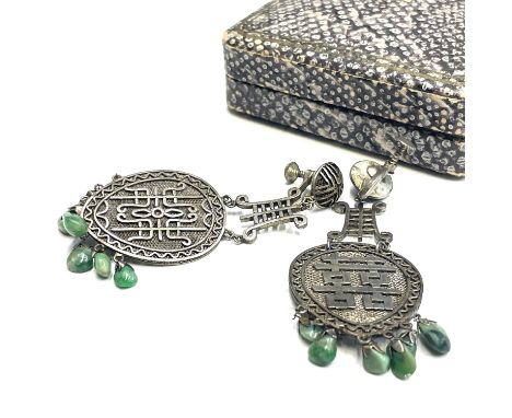 A pair of Chinese silver pendant drop earrings, each with six jade beads, length 6.5cm, width 3cm.
