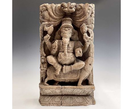 A large Indian carved wood panel of Ganesh, early-mid 20th century, height 45cm, width 26cm, depth 8.3cm.Condition report: We