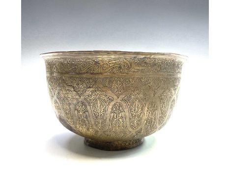 An Indian tinned copper bowl, Deccan, late 18th/early 19th century, with arabic calligraphy beneath the top rim, height 12.5c