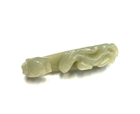 A Chinese jade belt hook, late Qing/Republic period, of typical form, with a dragon's head and chilong climbing up the body, 