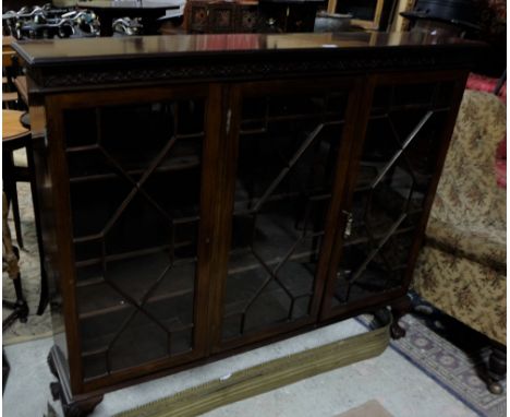 3 door mahogany display cabinet with Chippendale fretwork on ball and claw feet, 57”w x 48”